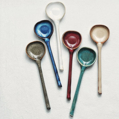 Elegant ceramic soup spoon with long handle and vibrant grey glaze, perfect for refined dining experiences