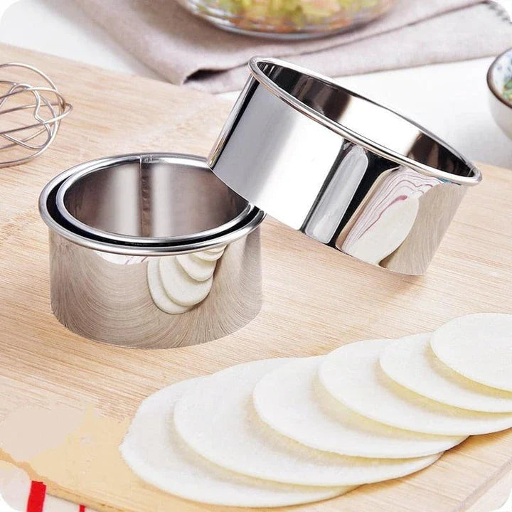 Premium stainless steel dumpling maker set with three distinct mold sizes for creating a variety of dumpling shapes
