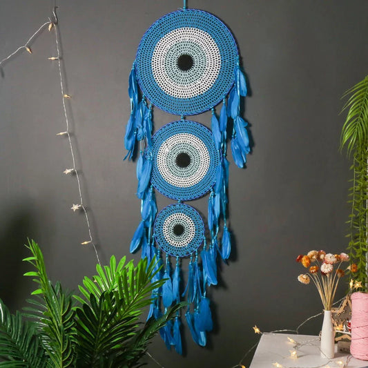 Colourful three-ring dreamcatcher wall hanging with feathers and beads, a unique and eye-catching home decor accent