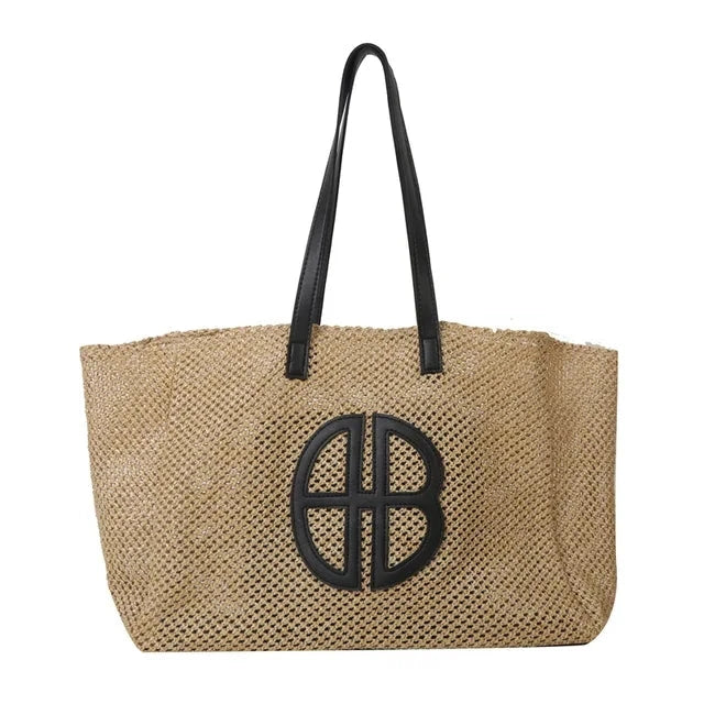 A handmade straw tote bag with a unique hollow-out knitting design, featuring a soft faux fur lining and a spacious interior for versatile use.