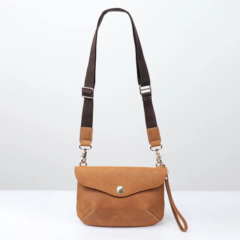Premium handcrafted leather messenger bag in a classic British design, featuring a sturdy construction and spacious interior for the modern gentleman's everyday essentials.