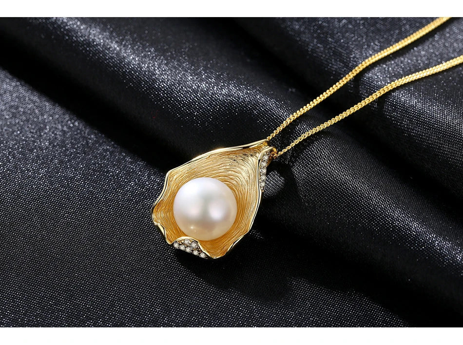Elegant pearl pendant necklace with sterling silver setting, featuring a modern geometric design