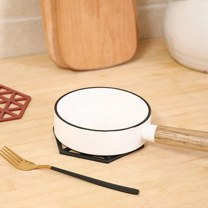 Geometric pattern cup coasters in a minimalist British design, made from durable rubber to protect surfaces