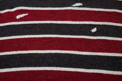 A cosy and stylish jumper featuring a patchwork design with contrasting stripes in a classic British colour palette.