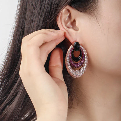 Elegant water drop-shaped ear studs in a vibrant red hue, adorned with a micro-inlaid zircon gemstone for a dazzling, sophisticated look.