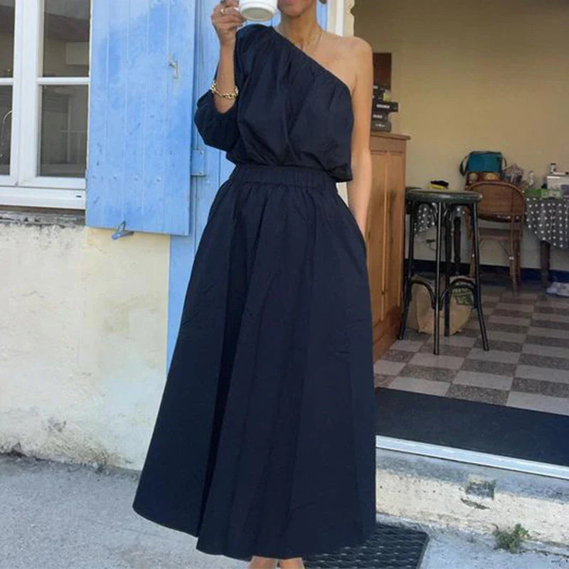 Elegant two-piece mid-length skirt suit with oblique shoulder design, made with premium polyester fabric and boutique four-sided elastic band
