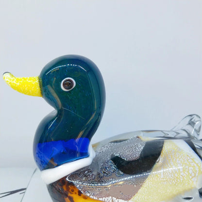 Handcrafted glass ornament in the shape of a Mandarin duck with vibrant colours and intricate details