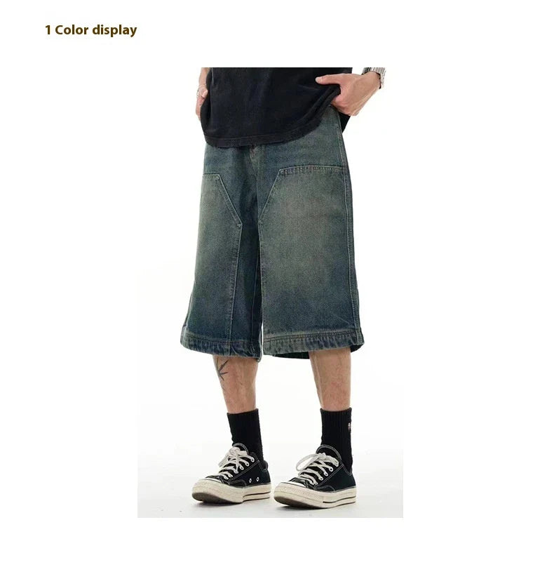 Relaxed-fit men's denim shorts in a vintage blue wash, featuring a wide-leg silhouette and adjustable waistband for maximum comfort.