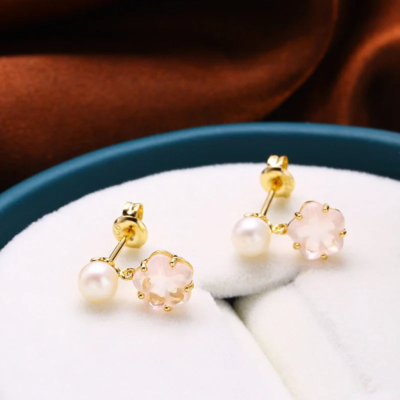 Hypoallergenic silver earrings with delicate cherry blossom crystal accents, perfect for sensitive skin