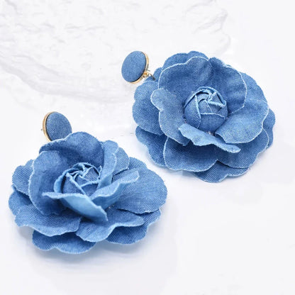 Exquisite denim drop earrings with charming accents, perfect for elevating British fashion and style