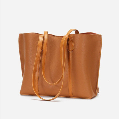 Premium cowhide leather shoulder bag with multiple compartments and adjustable strap for versatile everyday use