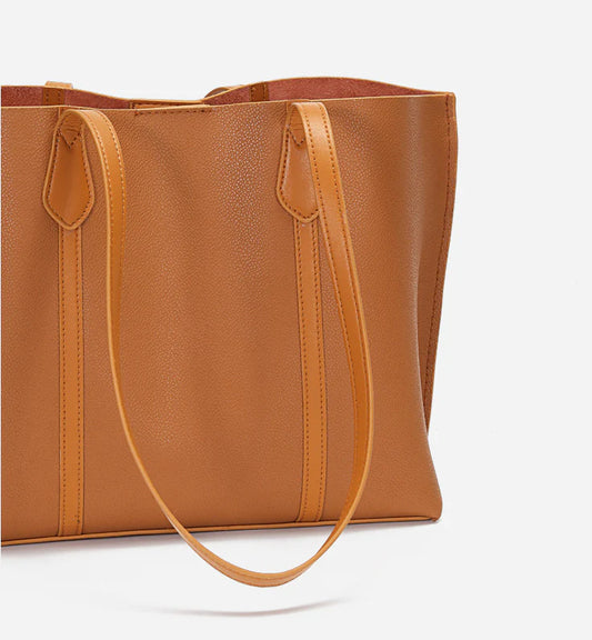 Premium cowhide leather shoulder bag with multiple compartments and adjustable strap for versatile everyday use