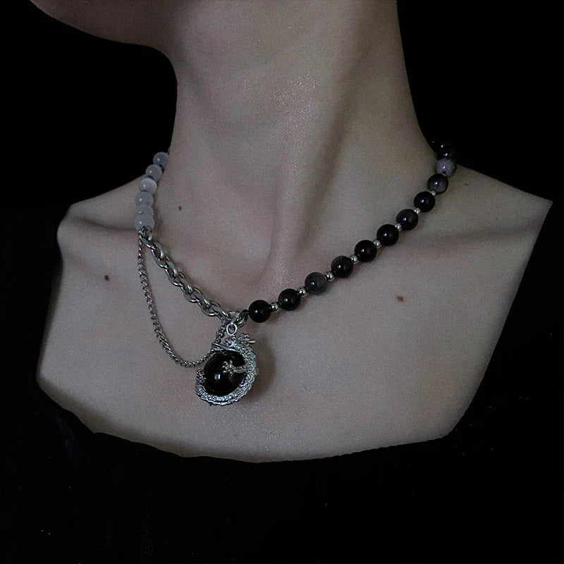 Titanium steel necklace with a black agate pendant featuring an intricate dragon design