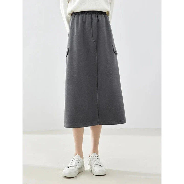 Elegant dark grey midi skirt with subtle sequin detailing, suitable for autumn and winter wear