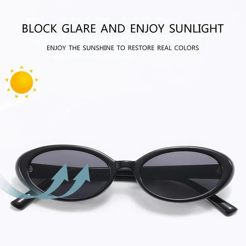 Oval-shaped women's sunglasses in a white and grey colour, offering UV protection and a stylish, retro-inspired design.