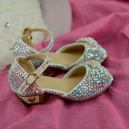 Enchanting princess crystal shoes with bow detail and dazzling crystals, perfect for girls' special occasions