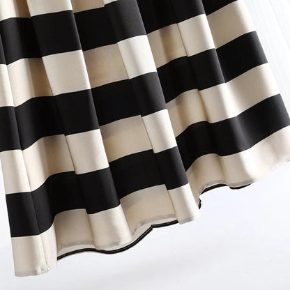Elegant striped midi skirt with pleated design, made from premium polyester for a sophisticated and comfortable look.