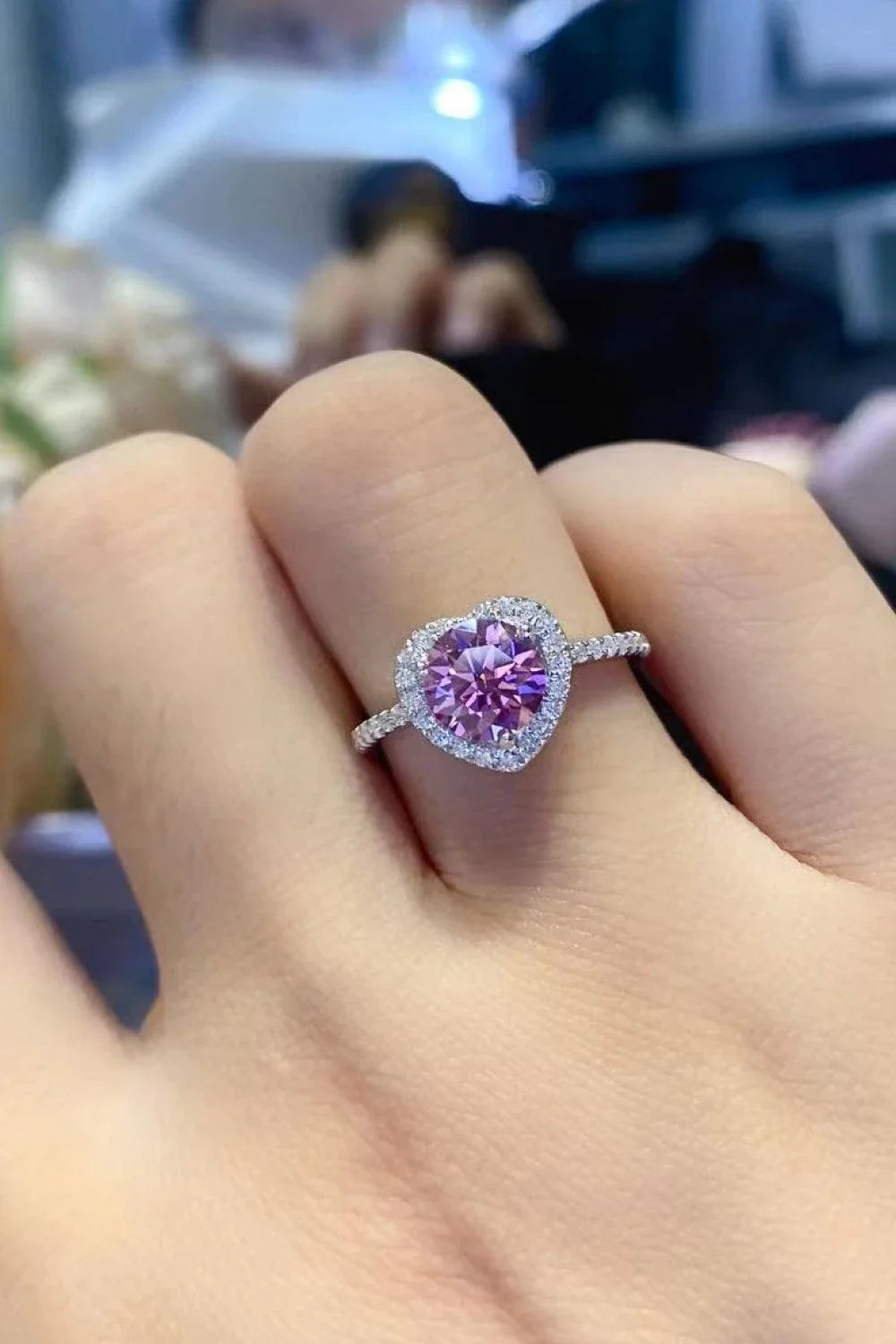 Elegant platinum-plated 925 sterling silver ring featuring a captivating 1 carat moissanite heart-shaped centre stone and sparkling zircon accents.