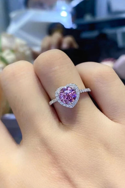Elegant platinum-plated 925 sterling silver ring featuring a captivating 1 carat moissanite heart-shaped centre stone and sparkling zircon accents.