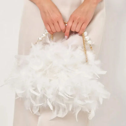Elegant feather clutch purse with lustrous pearls, metal chains, and a top handle design