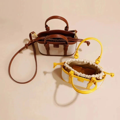 Refined genuine leather women's messenger bag in a stylish, square shape with a convenient string closure and adjustable shoulder strap.