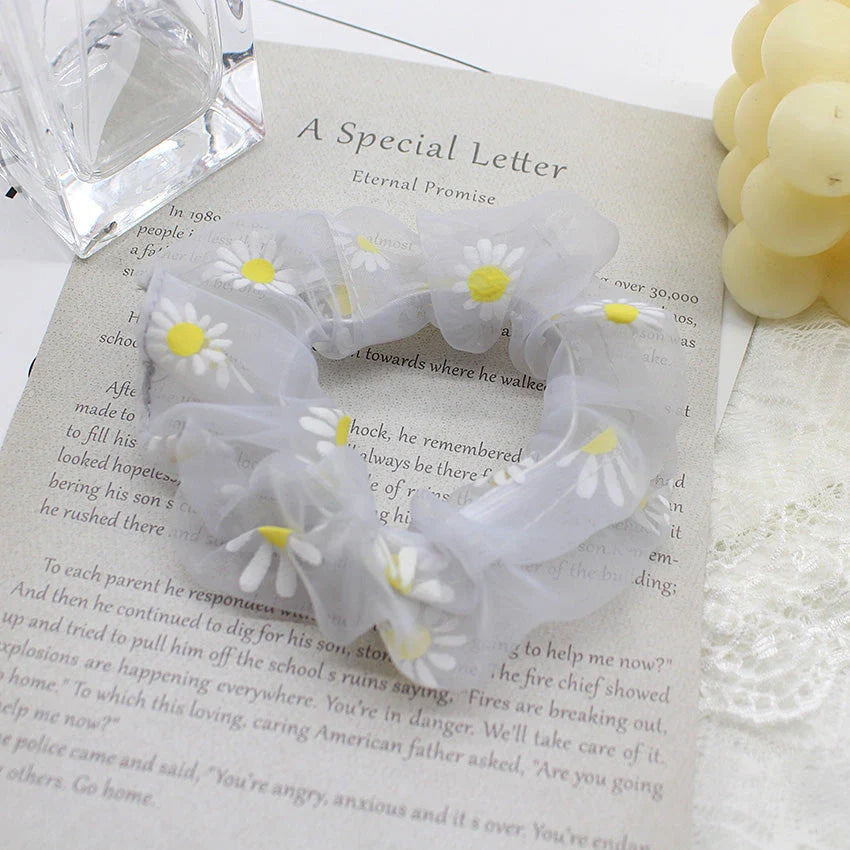 Handmade floral elastic hair bands with soft chiffon fabric and vibrant embroidered daisy patterns, perfect for enhancing everyday style in the UK.