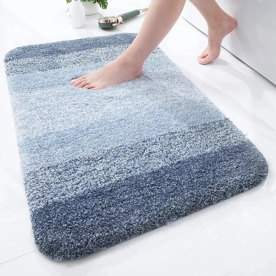 Luxurious microfibre absorbent bath mat in grey, featuring soft coral velvet surface and high-density memory foam cushioning