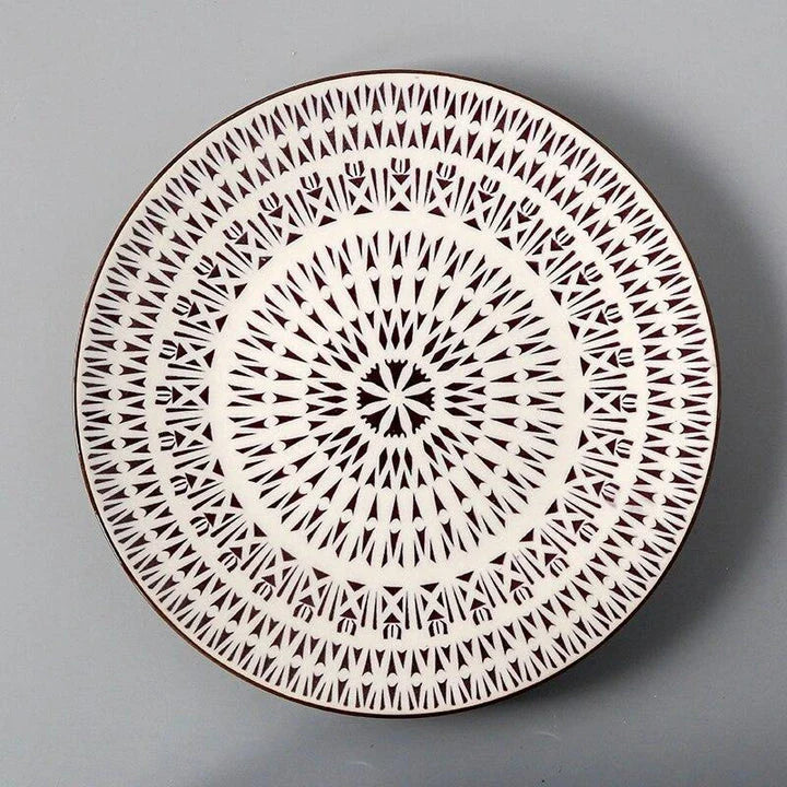 Elegant ceramic plates with vibrant, whimsical prints in a variety of enchanting designs