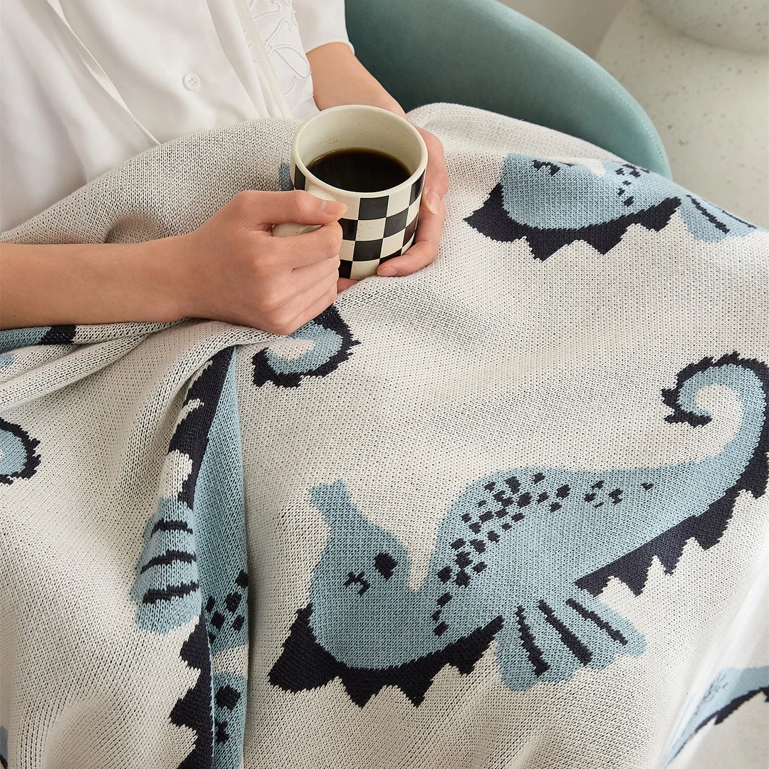Soft and cosy 100% cotton blanket with a charming sea horse design, perfect for relaxation at home or on the go.