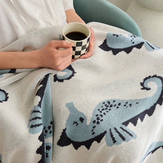 Soft and cosy 100% cotton blanket with a charming sea horse design, perfect for relaxation at home or on the go.