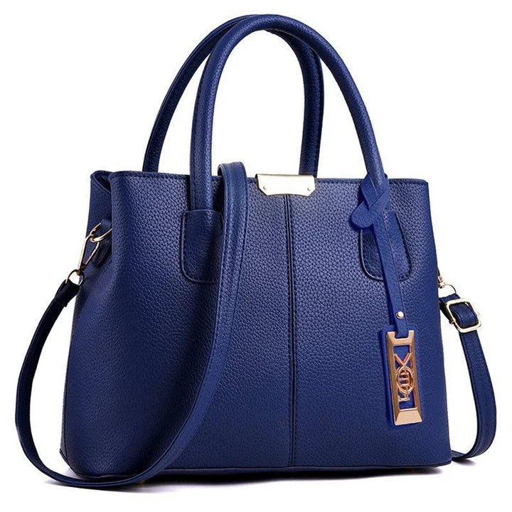 A stylish one-shoulder tote bag in various colours, made of premium polyester with an adjustable strap and spacious interior for the modern professional woman.