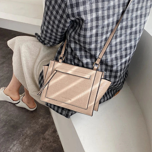 Premium British-designed messenger bag in wine red colour, featuring a spacious and stylish design with a single strap for comfortable carrying.