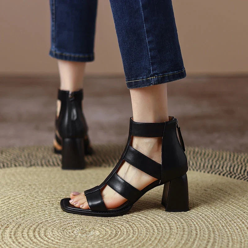 Luxurious leather gladiator sandals with square heel and buckle strap, providing style and comfort for any occasion.
