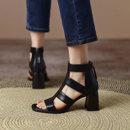 Luxurious leather gladiator sandals with square heel and buckle strap, providing style and comfort for any occasion.