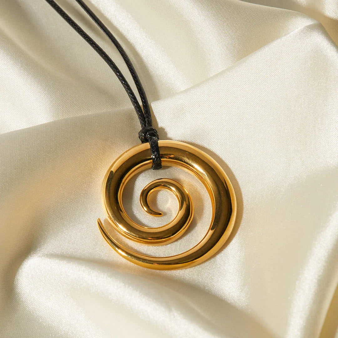 Exquisite spiral circle pendant necklace with 18K gold plating and black rope chain, a versatile accessory for the modern British woman.