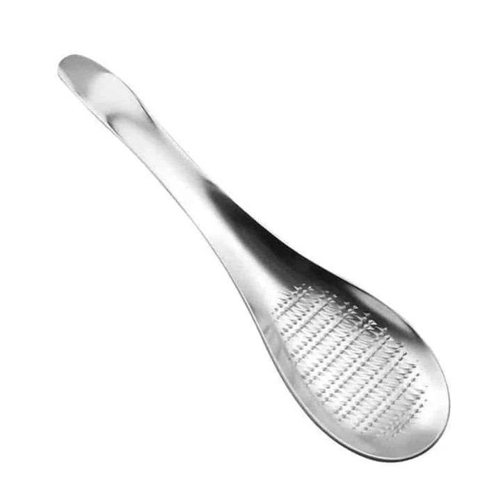 Premium stainless steel multi-purpose grater with ergonomic handle for easy grating and shredding in the modern British kitchen