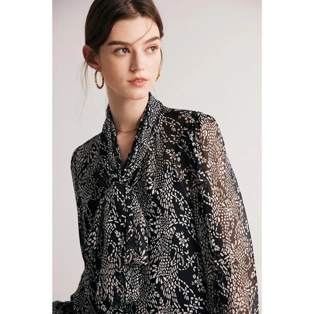 Elegant black silk blouse with unique bow collar, designed for a flattering fit and all-day comfort.