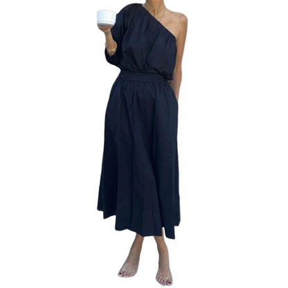 Elegant two-piece mid-length skirt suit with oblique shoulder design, made with premium polyester fabric and boutique four-sided elastic band