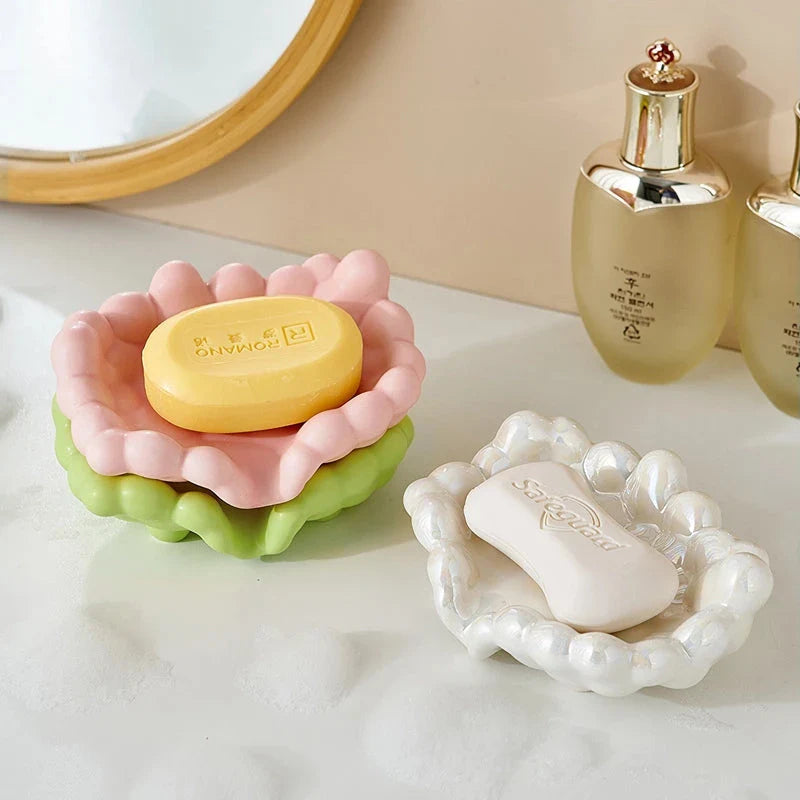 A ceramic soap dish with a whimsical cloud design, perfect for elevating your bathroom decor.