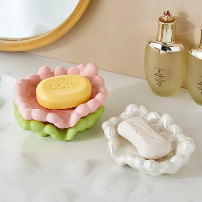 A ceramic soap dish with a whimsical cloud design, perfect for elevating your bathroom decor.