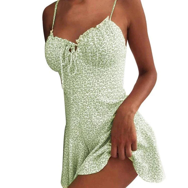 Floral mini dress with vibrant prints, soft polyester fabric, and a flattering silhouette for a stylish look.
