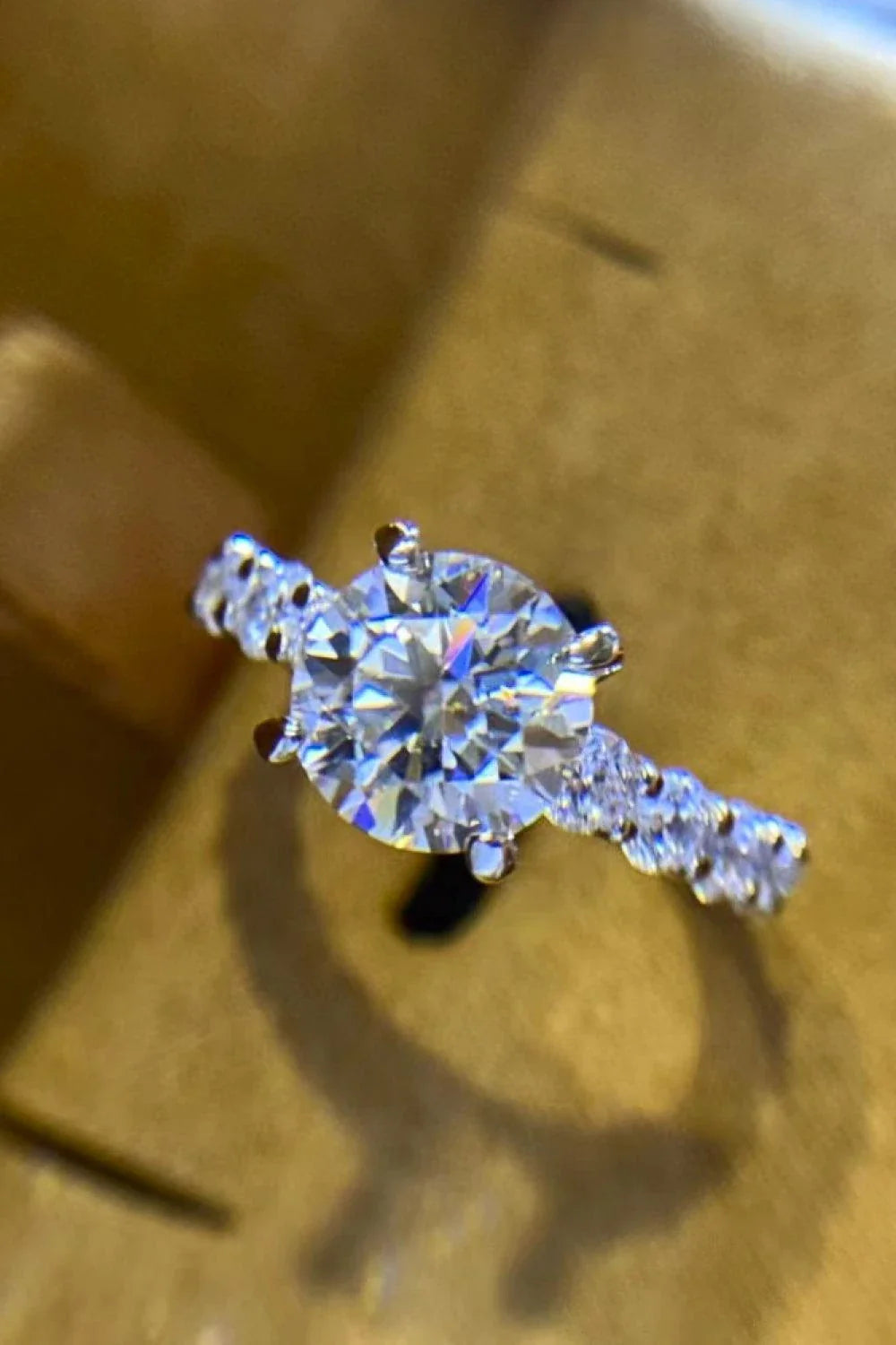 Exquisite 2-carat moissanite solitaire ring in 925 sterling silver, featuring a mesmerising centre stone and delicate metalwork for a modern, minimalist design.