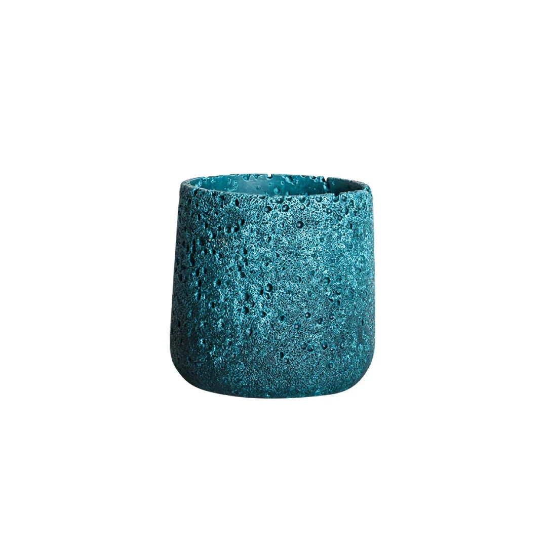 A modern, perforated cement bonsai planter in a Nordic-inspired design, available in various sizes and colours.