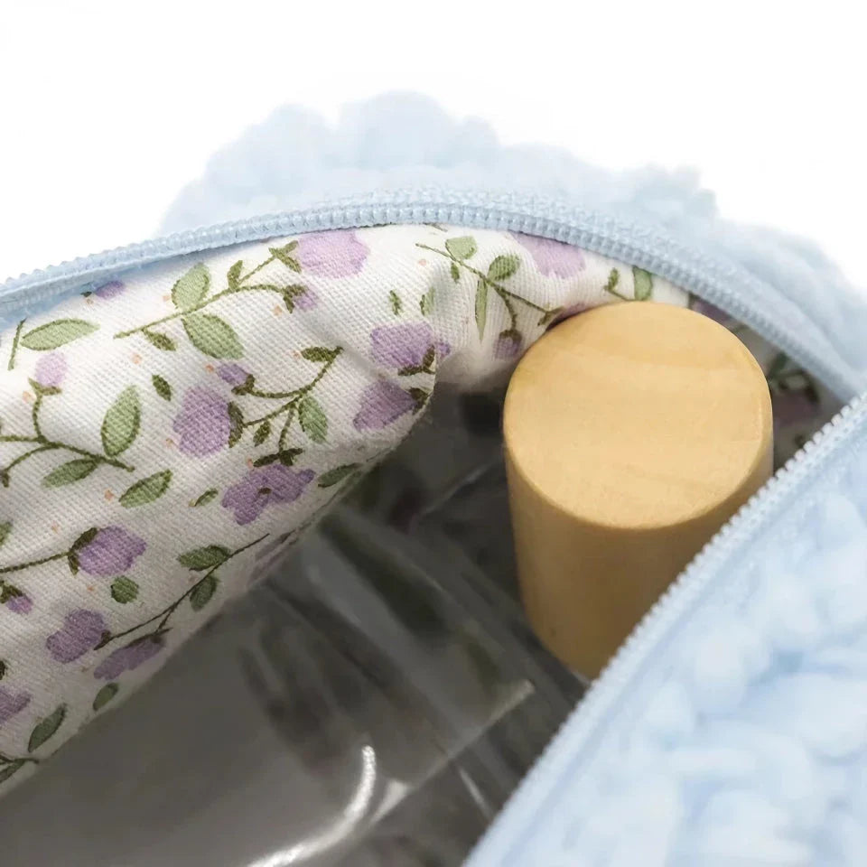 Plush lambswool exterior of the Luxurious Lambswool Multi-Purpose Cosmetic Bag in Khaki colour, with a robust zipper closure and spacious interior for organising makeup and other essentials.