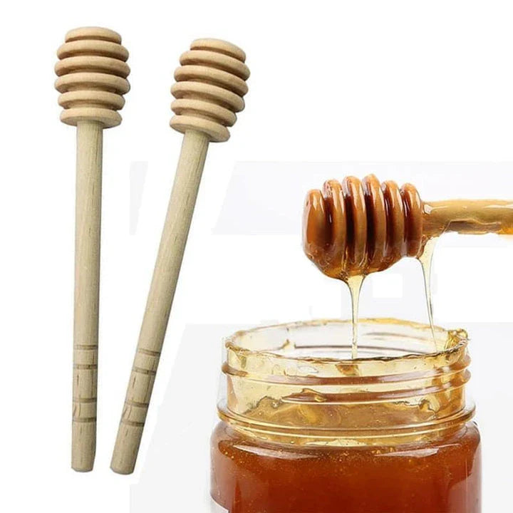 Handcrafted wooden honey spoon with a natural beeswax finish, showcasing the elegant design and timeless British craftsmanship.