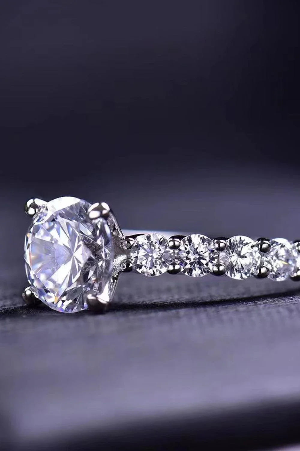 Exquisite 2-carat moissanite solitaire ring in 925 sterling silver, featuring a mesmerising centre stone and delicate metalwork for a modern, minimalist design.