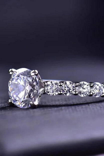 Exquisite 2-carat moissanite solitaire ring in 925 sterling silver, featuring a mesmerising centre stone and delicate metalwork for a modern, minimalist design.