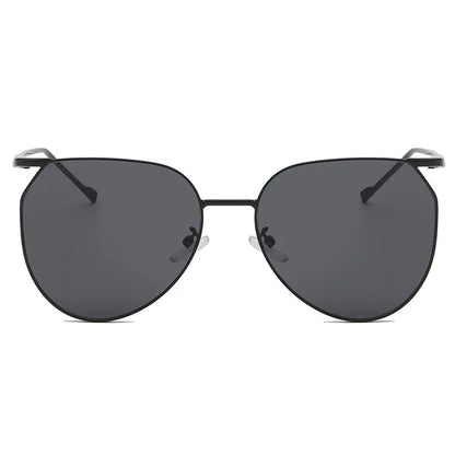 Elegant oval-shaped sunglasses with gradient lenses and alloy frames, offering timeless British style and UV protection.