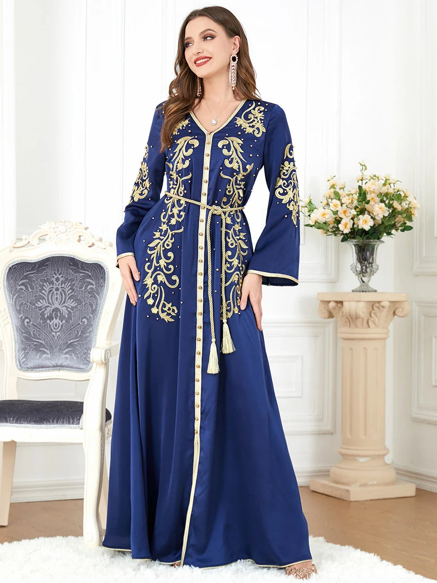 Elegant long-sleeve dress with floral embroidery in a sophisticated sapphire blue colour, suitable for British women
