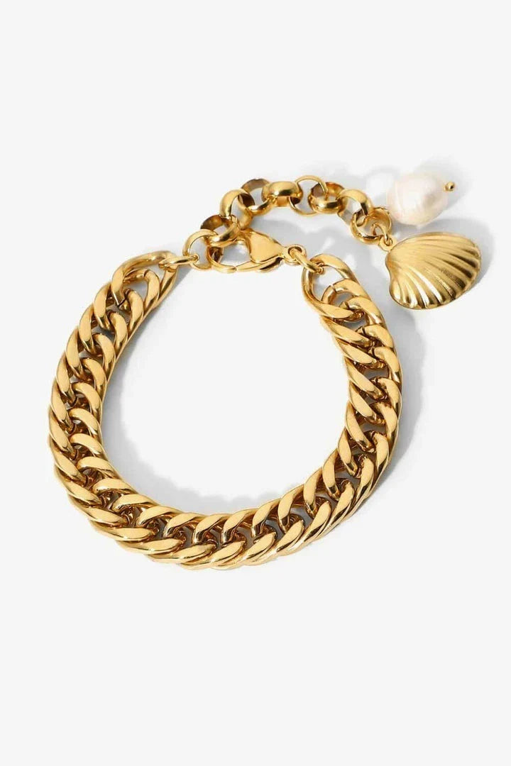 Elegant 18-carat gold-plated curb chain bracelet with a delicate pearl accent, showcasing premium British craftsmanship